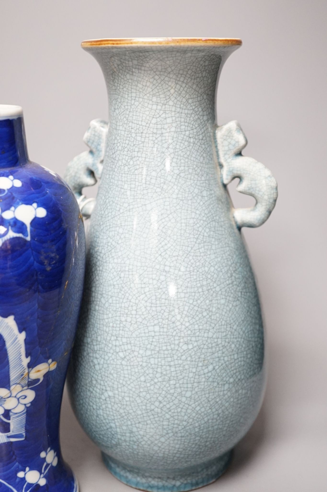 A Chinese blue and white Prunus vase, a Chinese enamelled porcelain bowl and a pale blue crackle glaze vase, tallest 32 cm